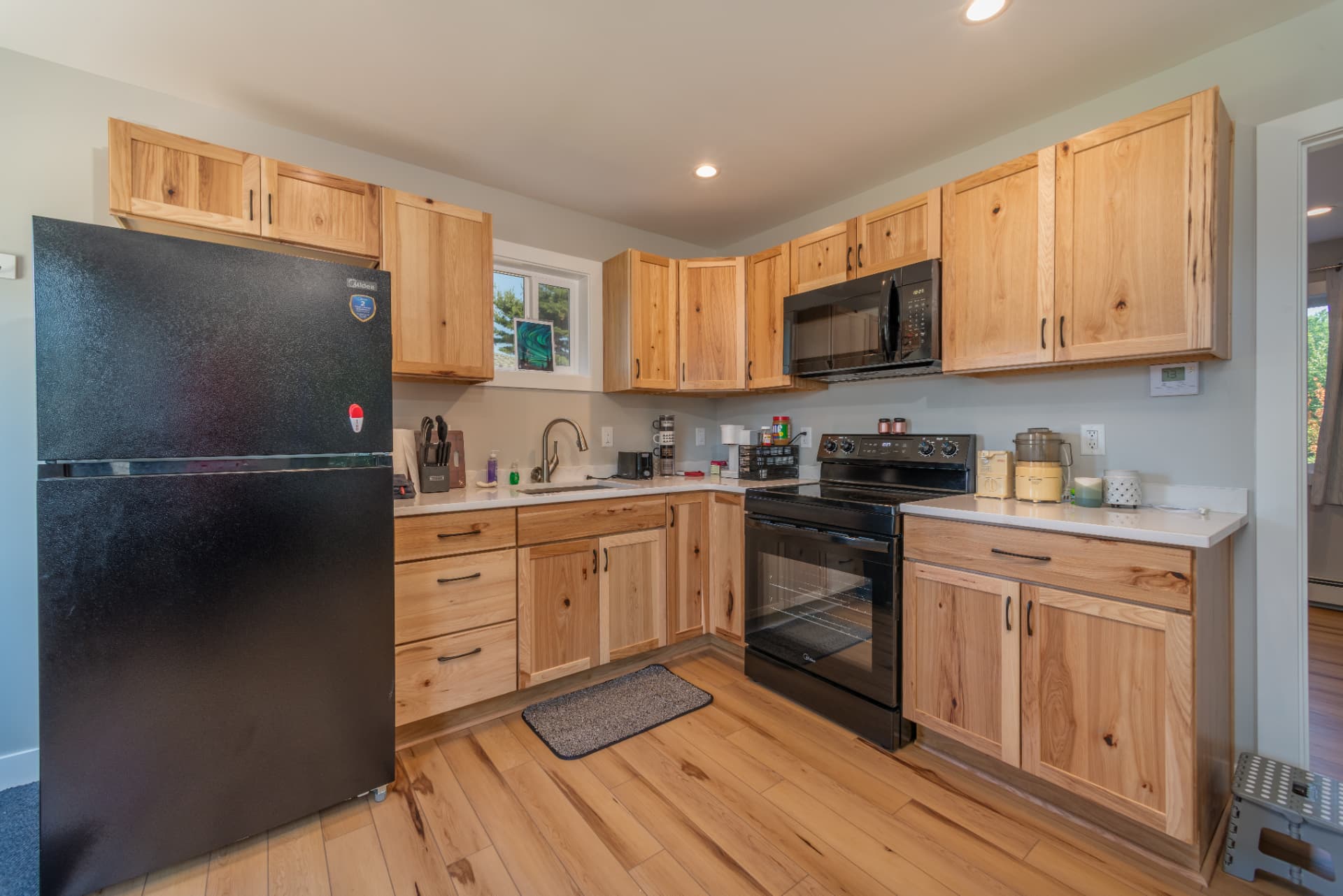 New hickory kitchen cabinets and quartz counters in Marquette, MI