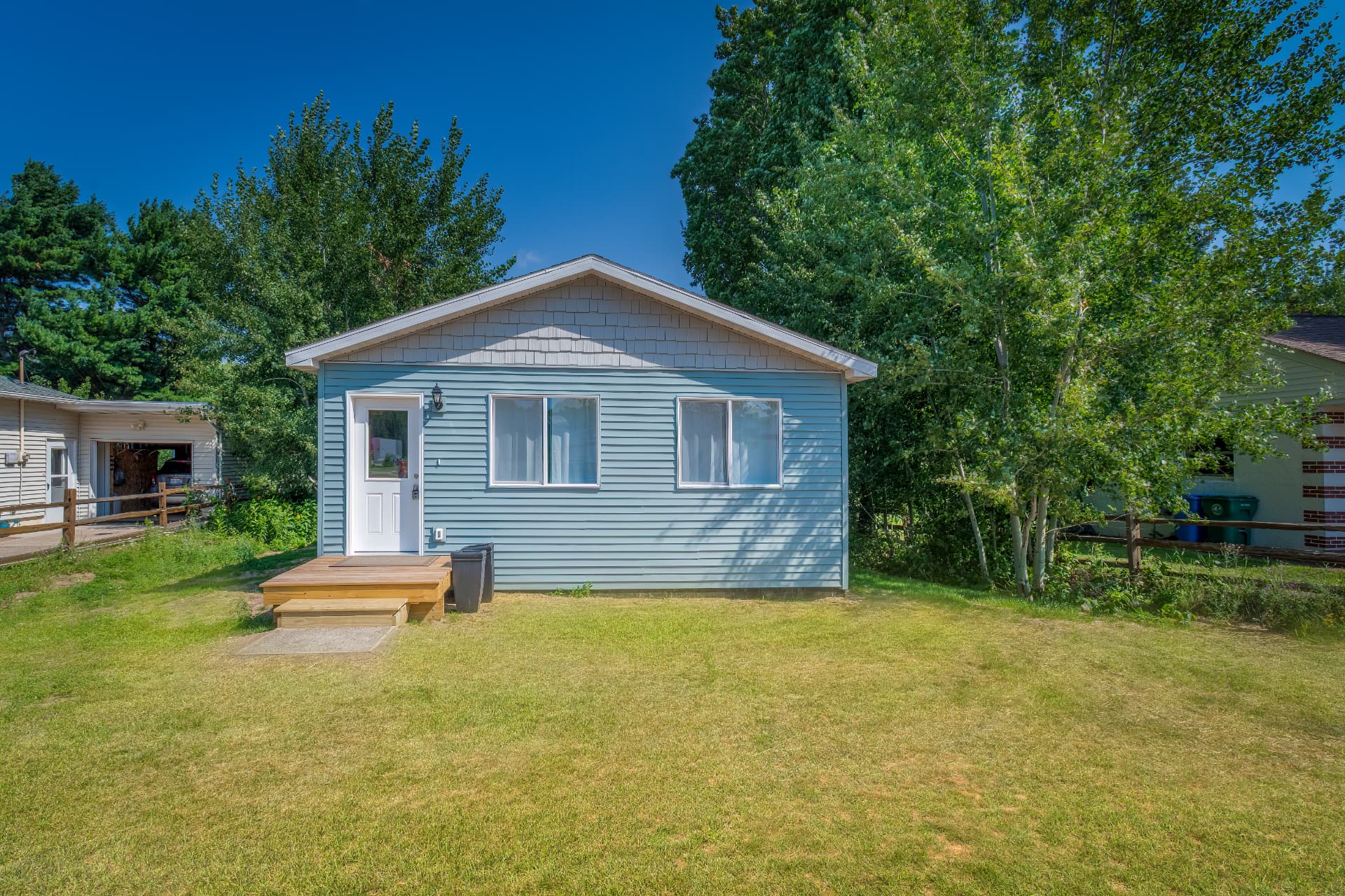Completed accessory dwelling unit exterior with new deck in Marquette, MI