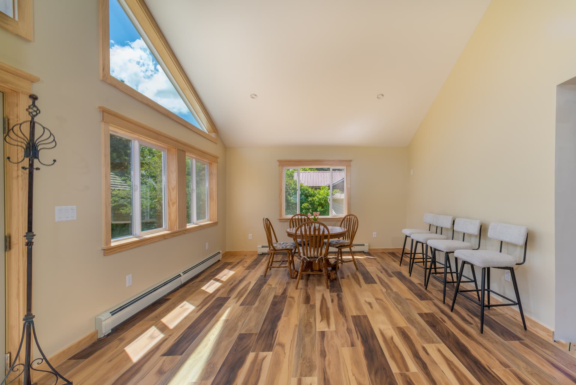 Dining area of the new addition with vaulted ceiling and baseboard heat in Ishpeming, MI